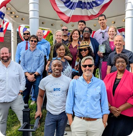 Members of the Norwalk Democratic Town Committee gathered outside a gazebo